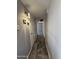 Hallway with hard flooring, lighting, and doors at 5815 N 21St Ave, Phoenix, AZ 85015