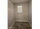 Well-lit laundry room with tile floor, window and washer/dryer hookups at 5815 N 21St Ave, Phoenix, AZ 85015
