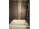 Modern tub shower combo with dark tile surround and copper mosaic accent tile at 5815 N 21St Ave, Phoenix, AZ 85015
