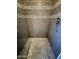 Close-up of stylish walk-in shower with decorative tile and modern fixtures at 5815 N 21St Ave, Phoenix, AZ 85015