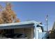 The house features a carport and mature trees at 5833 W Rosewood Ln, Phoenix, AZ 85031