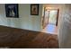 Living room with patterned carpet and entrance view at 5833 W Rosewood Ln, Phoenix, AZ 85031