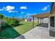 Expansive backyard featuring a well-manicured lawn and mature trees for added privacy at 6160 E Inglewood St, Mesa, AZ 85205
