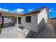 Covered patio and rear exterior view showcasing access to backyard and window features at 6160 E Inglewood St, Mesa, AZ 85205