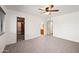 Bright bedroom with carpeted floors, walk-in closet, and an ensuite bathroom at 6160 E Inglewood St, Mesa, AZ 85205