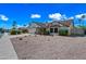 Charming single-story home with gravel landscaping, mature trees, and inviting curb appeal at 6160 E Inglewood St, Mesa, AZ 85205