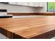 Detailed view of a wood kitchen countertop with a view of appliances at 6160 E Inglewood St, Mesa, AZ 85205