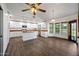 Bright eat-in kitchen featuring white cabinets, wood countertops and an island at 6160 E Inglewood St, Mesa, AZ 85205