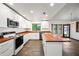 Bright kitchen featuring white cabinets, wood countertops, and stainless steel appliances at 6160 E Inglewood St, Mesa, AZ 85205