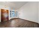 Inviting living room featuring wood-look flooring and large windows at 6160 E Inglewood St, Mesa, AZ 85205