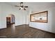 Open concept living area showcases arched doorway and a kitchen view at 6160 E Inglewood St, Mesa, AZ 85205