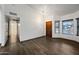 Open concept living space with wood-look flooring and many windows for natural light at 6160 E Inglewood St, Mesa, AZ 85205