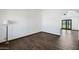 An empty room with beautiful flooring and an archway to another room at 6160 E Inglewood St, Mesa, AZ 85205