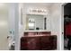 Bathroom featuring dark wood vanity and lighting, complemented by an open, airy design at 630 E Jensen St # 102, Mesa, AZ 85203