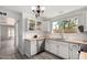 Bright kitchen featuring butcher block countertops, subway tile backsplash, and stainless steel appliances at 630 E Jensen St # 102, Mesa, AZ 85203