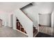 Open-concept living area with staircase, wine storage, and tile floors, ideal for modern living at 630 E Jensen St # 102, Mesa, AZ 85203