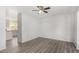 Open living space showcasing modern flooring and seamless transition to the adjacent kitchen area at 630 E Jensen St # 102, Mesa, AZ 85203