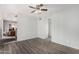 Open living space with modern flooring, ceiling fan, and transitions to the kitchen at 630 E Jensen St # 102, Mesa, AZ 85203
