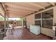 Covered outdoor patio with tile flooring and direct access to backyard and featuring exterior windows at 630 E Jensen St # 102, Mesa, AZ 85203