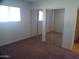 Bedroom with carpet flooring and closet with mirrored sliding doors at 720 S Dobson Rd # 95, Mesa, AZ 85202