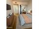 Modern bedroom with a dresser, soft lighting, and a mirror-doored closet at 720 S Dobson Rd # 95, Mesa, AZ 85202