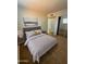 Cozy bedroom with a queen-sized bed, neutral colors, and ample closet space at 720 S Dobson Rd # 95, Mesa, AZ 85202
