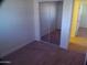 Bedroom with carpet flooring and closet with mirrored sliding doors at 720 S Dobson Rd # 95, Mesa, AZ 85202