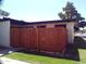 Exterior view of a home featuring privacy fence, well-maintained lawn and manicured landscaping at 720 S Dobson Rd # 95, Mesa, AZ 85202