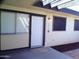 Inviting front door with fresh white paint framed by dark trim and leading to a well lit interior at 720 S Dobson Rd # 95, Mesa, AZ 85202