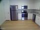 Well-equipped kitchen showcasing stainless steel appliances and ample white cabinetry at 720 S Dobson Rd # 95, Mesa, AZ 85202