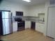 Bright kitchen featuring stainless steel appliances, marble countertops and white cabinetry at 720 S Dobson Rd # 95, Mesa, AZ 85202