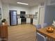 Bright kitchen featuring stainless steel appliances, white cabinets, and modern countertops at 720 S Dobson Rd # 95, Mesa, AZ 85202