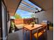 Inviting covered patio featuring a wooden table and chairs, perfect for outdoor dining and relaxation at 720 S Dobson Rd # 95, Mesa, AZ 85202