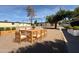 Community playground and seating area with a wooden dining set, providing a fun and social outdoor space at 720 S Dobson Rd # 95, Mesa, AZ 85202