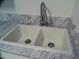 A close up of a dual basin white sink with marble countertops and modern faucet at 720 S Dobson Rd # 95, Mesa, AZ 85202