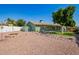 Expansive backyard featuring gravel landscaping, a fire pit, and plenty of space for outdoor enjoyment at 810 W Villa Maria Dr, Phoenix, AZ 85023