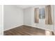 Bright bedroom boasts wood-look flooring, window, and neutral-colored walls at 810 W Villa Maria Dr, Phoenix, AZ 85023