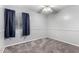 Bright bedroom with neutral colors, a ceiling fan, and large window at 810 W Villa Maria Dr, Phoenix, AZ 85023