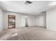 Large bonus room featuring neutral carpet, multiple closets and access to other rooms at 810 W Villa Maria Dr, Phoenix, AZ 85023