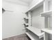 Walk-in closet features a carpeted floor and built in white shelving at 810 W Villa Maria Dr, Phoenix, AZ 85023
