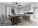 Charming dining room with table for four, white cabinetry and stainless steel appliances at 810 W Villa Maria Dr, Phoenix, AZ 85023
