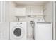 Laundry room featuring both washer and dryer with storage cabinet and wire rack at 810 W Villa Maria Dr, Phoenix, AZ 85023