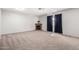 Cozy living room featuring neutral carpet and a wood-trimmed fireplace at 810 W Villa Maria Dr, Phoenix, AZ 85023