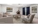 Cozy living room with fireplace, neutral color palette, and lots of natural light at 810 W Villa Maria Dr, Phoenix, AZ 85023