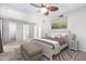 Calming main bedroom with neutral color palette, ceiling fan, and ample closet space at 810 W Villa Maria Dr, Phoenix, AZ 85023