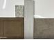 Close-up of various flooring and cabinet material samples for the home's interior finishes at 820 W Riparian Dr, San Tan Valley, AZ 85140