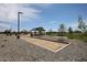Bocce ball court near a shaded picnic area enhances the community park at 823 W Riparian Dr, San Tan Valley, AZ 85140