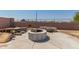 Backyard with a built-in fire pit and seating area for outdoor entertainment at 829 S 111Th Dr, Avondale, AZ 85323