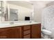 Well-lit bathroom with double sink vanity, large mirror, and shower-tub combination at 829 S 111Th Dr, Avondale, AZ 85323