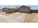 Single-Gathering home featuring a two-car garage, desert landscaping, and a concrete driveway at 829 S 111Th Dr, Avondale, AZ 85323